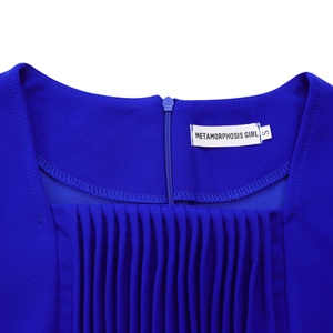 Close-up of royal blue square neck dress featuring pleated texture and hidden back zipper
