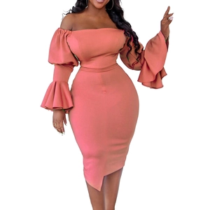 Close-up of coral pink off-shoulder dress with layered ruffle bell sleeves and knit texture
