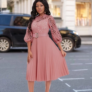Detail of pink lace hollow design and pleated chiffon fabric with an elegant waist belt