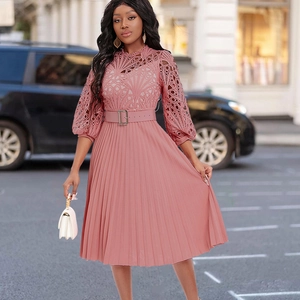 Detail of pink lace bodice and pleated skirt with lantern sleeves on women's dress