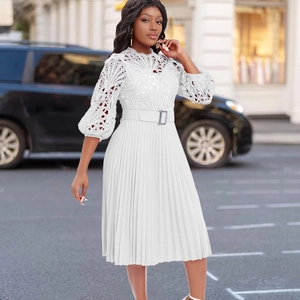 Elegant white lace dress with pleated skirt and lantern sleeves for a sophisticated summer look