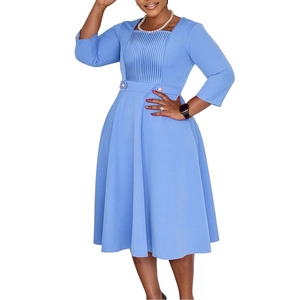 Detailed square neck and pleated bodice of a blue A-line midi dress with decorative buttons