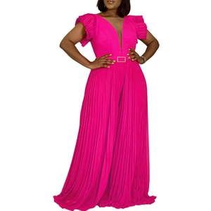 Detail of hot pink pleated maxi dress with deep V-neck and gold buckle waist belt