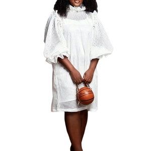 White lace hollow midi dress featuring high ruffle neck and statement puff sleeves