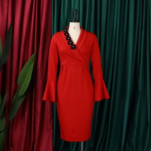 Close-up of elegant red V-neck dress featuring bell sleeves and 3D floral beaded appliques
