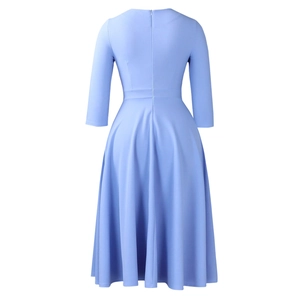 Detail of the back invisible zipper and fitted waist of this light blue A-line dress