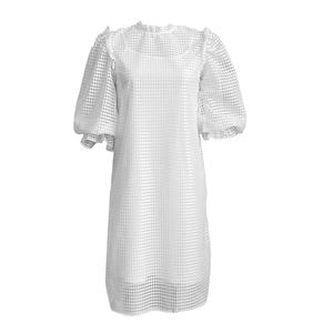 Detail of white hollow lattice fabric with puff sleeves and elegant ruffled collar design