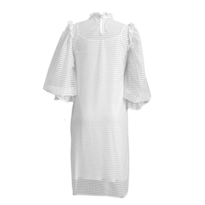 Detail of the high ruffle neck and back keyhole closure on a white plaid puff sleeve dress