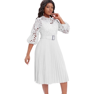Detailed view of white crochet lace bodice with hollow lantern sleeves on pleated dress