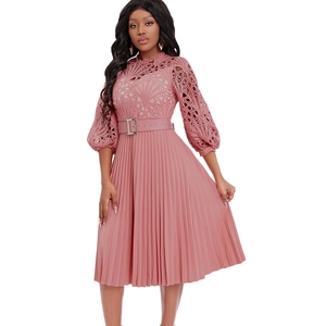 Detail of pink lace bodice with lantern sleeves and pleated skirt on a midi dress