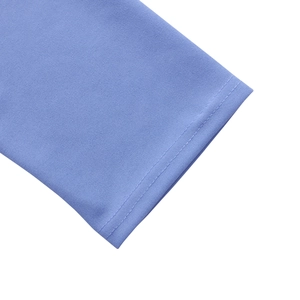 Close-up of light blue fabric showing neat double-needle stitching and fine texture detail