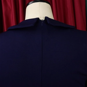 Detail of the back invisible zipper and refined mesh pleats on this dark blue dress