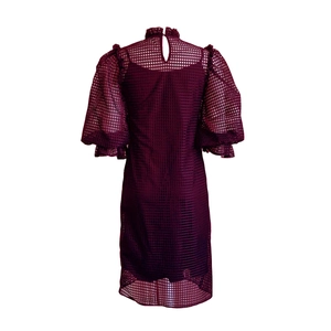 Detail view of burgundy wine hollow mesh fabric and layered ruffle back collar on dress