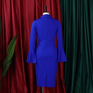 Detail of royal blue dress featuring elegant flared sleeves and back slit hem design