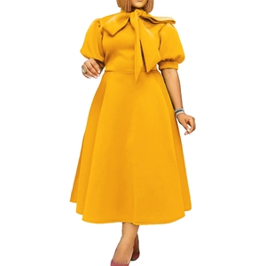 Detail of bright yellow puff sleeve midi dress with bow neckline and A-line flared hem