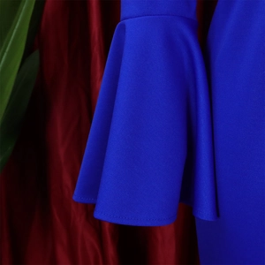 Detailed macro view of the royal blue bell sleeve with premium knitted fabric texture