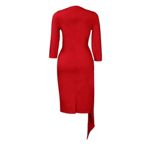 Detail view of red midi dress with invisible back zipper and asymmetrical draped hemline