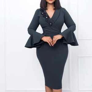 Detail of elegant V-neck dress featuring 3D floral lace applique and large bell sleeves
