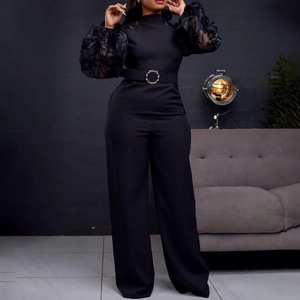 Elegant black wide-leg jumpsuit with sheer puff sleeves and waist belt for women
