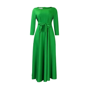 Detail view of M size label and adjustable waist tie on this green long maxi dress