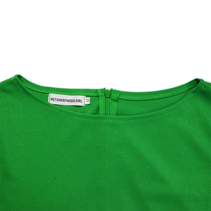 Detail of round neckline and back zipper on green textured dress with brand label