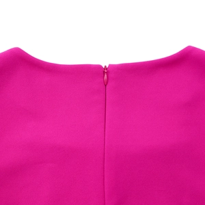 Detail of rose pink dress featuring a seamless back invisible zipper and textured fabric