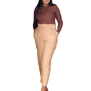 Detail of high waisted trousers with a matching wide belt and straight leg cut for women