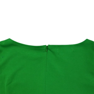 Detail view of grass green dress showing high-quality invisible zipper and neckline sewing