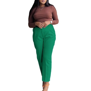 Detail view of high waisted green straight leg suit pants with front pleat design