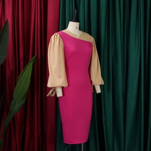 Detail of elegant bishop sleeves with chic bow ribbons on a contrast color dress