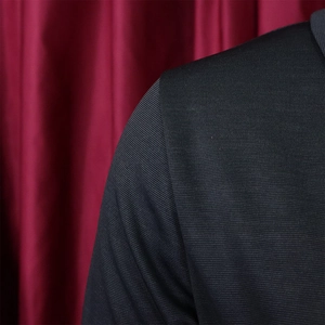 Close-up of the woven fabric texture and shoulder detail on this elegant business dress