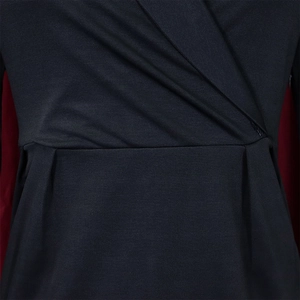 Detail of elegant wrap V-neck and waist pleats on navy blue textured formal dress