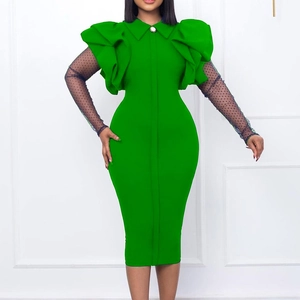 Detail of green bodycon dress featuring mesh polka dot sleeves and tiered shoulder ruffles