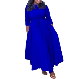 Detail of royal blue maxi dress featuring a waist tie and elegant pleated flared hemline