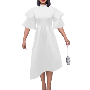 Detail of elegant white dress featuring tiered ruffle sleeves and asymmetrical ruffled hemline