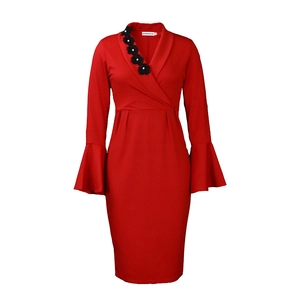 Detailed view of red V-neck dress featuring 3D black flower appliques with pearls
