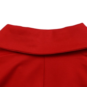 Macro shot of the red V-neck dress showing fine fabric texture and neat stitching details