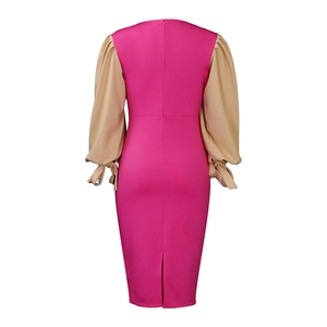 Rear view of rose red midi dress featuring beige puff sleeves with decorative wrist ties