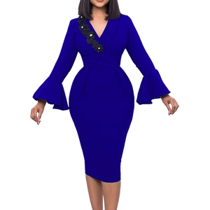 Detail of royal blue V-neck dress featuring bell sleeves and black lace flower applique
