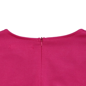 Detail of rose red dress showing invisible zipper and horizontal fabric texture