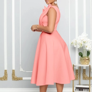 Elegant coral pink sleeveless plus size party dress with stylish ruffle neckline detail