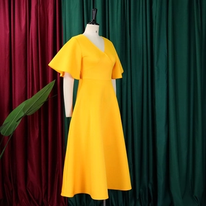Detail view of V-neckline and flare sleeves on a vibrant yellow A-line party dress