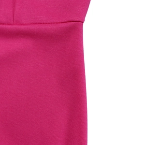 Close-up of deep pink ribbed knit fabric showing fine texture and clean seam detail