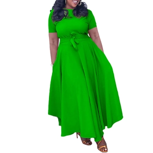 Detail of green maxi dress featuring a short sleeve design and elegant waist tie bow