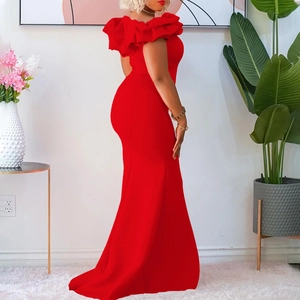 Close-up of red off-shoulder fishtail dress with dramatic ruffled neckline detail