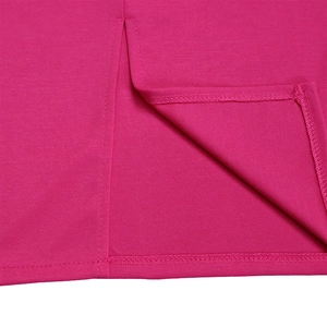 Detailed close-up of double-stitched hem on high-stretch rose red knit fabric dress