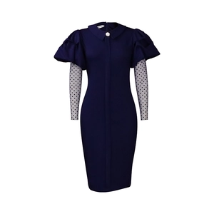 Detail of navy slim fit dress featuring bubble sleeves and white polka dot mesh fabric