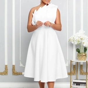 Close-up of elegant white one-shoulder midi dress featuring sculptural ruffled pleats