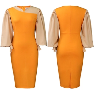 Detail of orange patchwork dress showing asymmetrical collar and back split hem