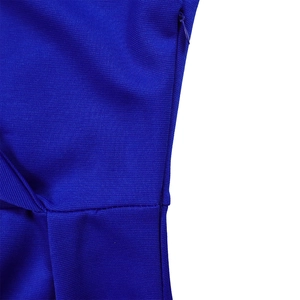 Close-up of the invisible side zipper and fine knit texture on the blue V-neck dress